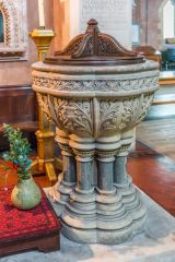 The richly-carved font