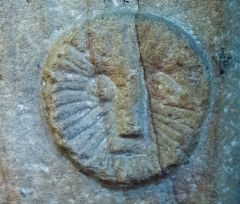 A sun symbol on the font base