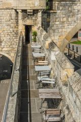 Cafe tables on the barbican parapet walk