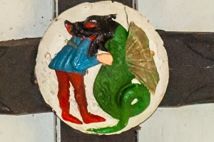 15th century roof boss, dragon devouring a man