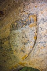 Worn shield over the sacristy entrance