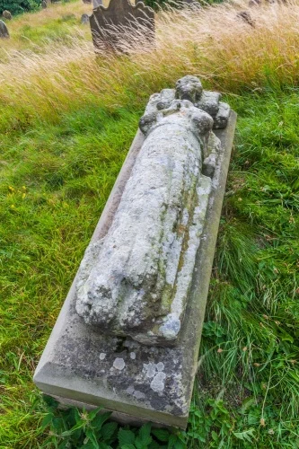 14th-century efigy in the churchyard