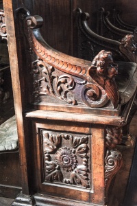 Carved pew, west end of the nave