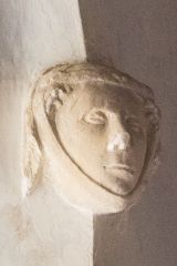 Medieval carved head, chancel arch