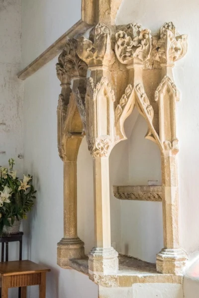 14th century angle piscina in the chancel