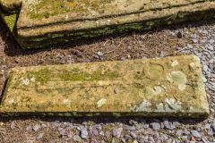 A medieval grave slab with a floriated cross carving