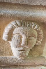 Carved face, nave column capital