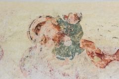 Medieval wall painting of St Christopher carrying the Christ child