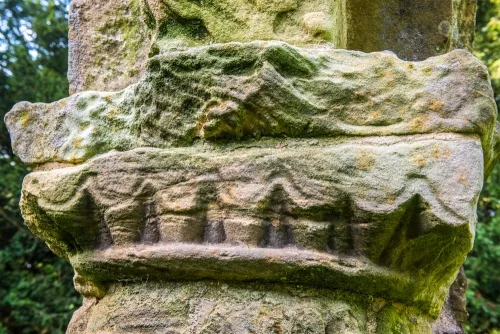 A worn 12th-century column capital