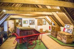 A post office cart and large willow chests