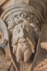A richly carved corbel head
