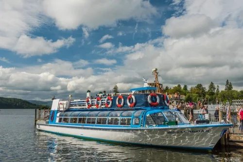 Boats take visitors on lake cruises from Bowness harbour