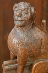 Choir stall arm rest of a defaced lion