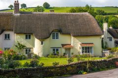 A picturesque thatched cottage at the village crossroads