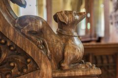 15th century carved bench end of a dog