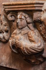 Angel holding a heart misericord