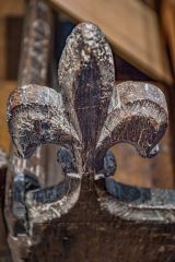 16th-century fleur-de-lys bench finial