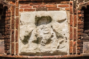 The very worn coat of arms