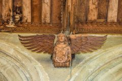 An ornately carved angel corbel