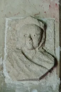 Carved head, south doorway