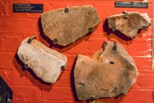 Tiles with nailmarks from Roman sandals