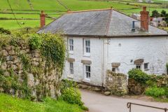A traditional whitewashed cottage near the village hall