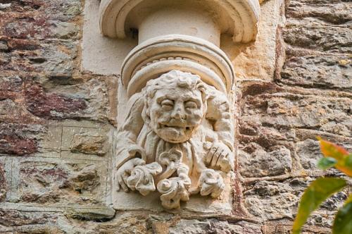 Grotesque figure, west wall
