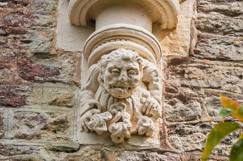 Grotesque figure, west wall