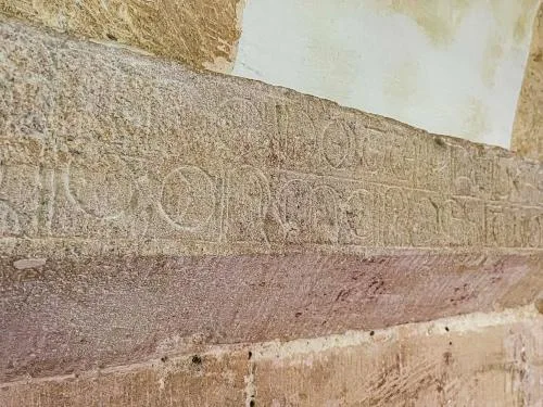 13th-century Latin inscription, chancel arch