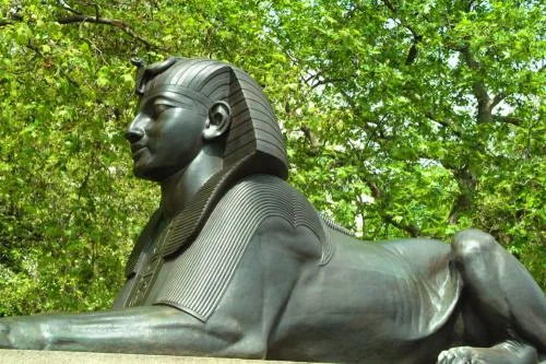 Stylised Egyptian sphinx at the base of the Needle