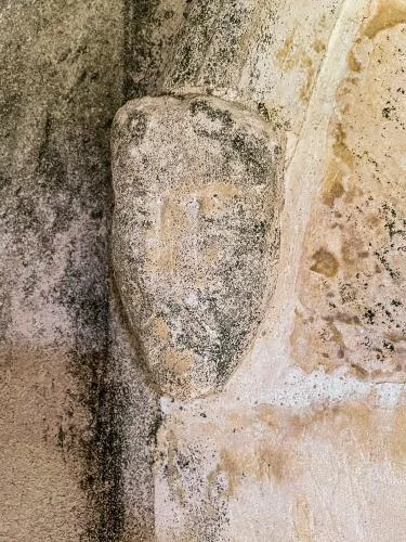 Carved head, south doorway