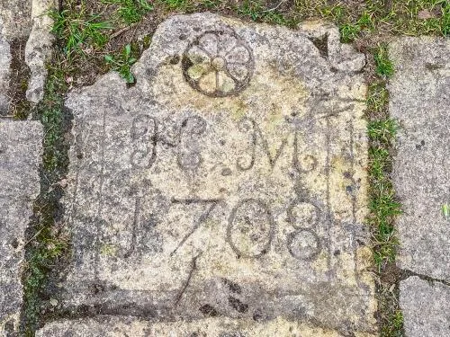 1708 gravestone, churchyard path