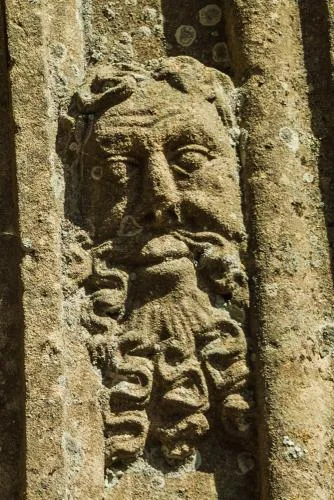 Carved head, south doorway