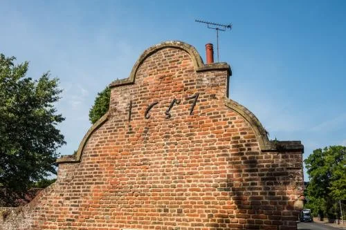 The east gable and 1657 ironwork date