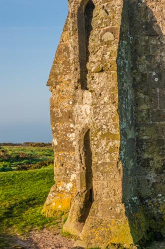 Thick medieval buttresses at the base