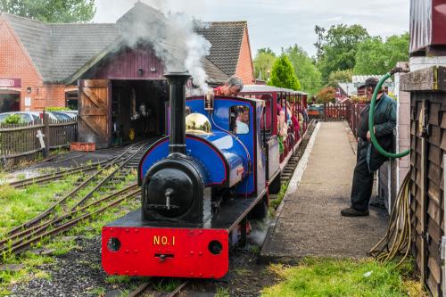 The steam railway pulling away from the station