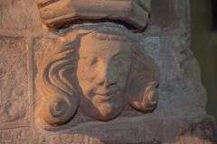 A carved corbel head