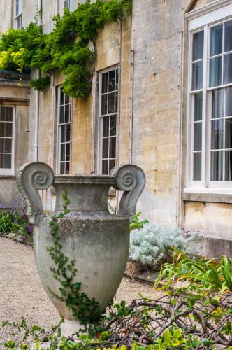 A neo-classical urn in front of the house entrance