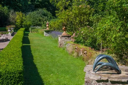 A garden terrace and hedges