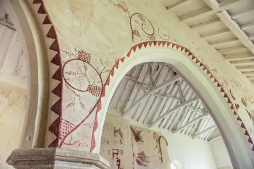 14th century paintings on the nave arcade