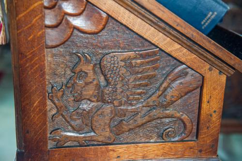 Winged beast carving, reading desk