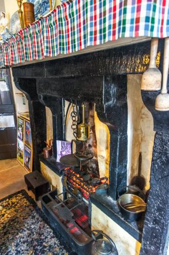 The original kitchen fireplace