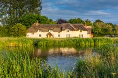 A thatched cottage on the River Test at Chilbolton