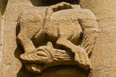 A serpent creature on the south door