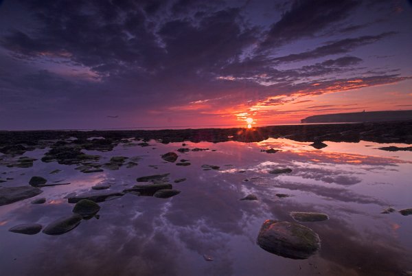 Sunset lights the western sky at Birsay. Photo of the Orkney Islands, Scotland.