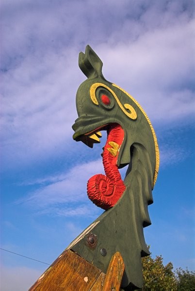 A reconstruction of a Viking longboat stands before the visitor centre at Orphir, where displays tell the tale of the Orkneyinga Saga. Photo of the Orkney Islands, Scotland.