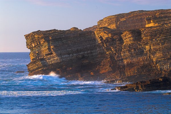 Late afternoon sunshine lights up the cliffs at Yesnaby, on the west coast of Orkney Mainland.