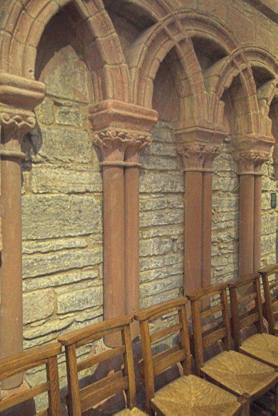 Pillars and interweaving arches decorate the wall of the north aisle. Photo of St Magnus Cathedral, Kirkwall, Orkney Islands, Scotland.
