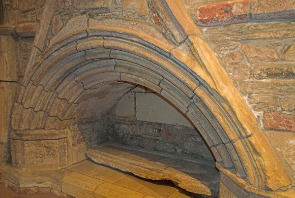 A medieval bishop's tomb tucked into the wall. Photo of St Magnus Cathedral, Kirkwall, Orkney Islands, Scotland.