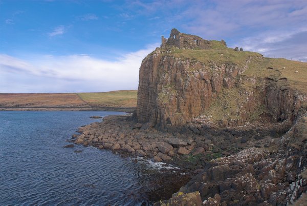 The rocky ruins of Duntulm Castle perched on a cliff above Tulm Bay on the north west end of the Trotternish Peninsula. Stock photo of the Isle of Skye, Scotland. Part of the Britain Express Travel and Heritage Picture Library, Scotland collection.